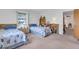 Guest bedroom with twin beds and built-in shelving at 430 Botticelli Dr # 430, Nokomis, FL 34275