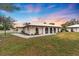 Single story home with a spacious lawn and sunset view at 430 Botticelli Dr # 430, Nokomis, FL 34275