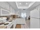 Modern kitchen with white appliances and a spacious layout at 430 Botticelli Dr # 430, Nokomis, FL 34275