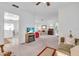 Spacious living room offering ample seating and views into the kitchen at 430 Botticelli Dr # 430, Nokomis, FL 34275