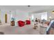 Bright living room with red accent chairs at 430 Botticelli Dr # 430, Nokomis, FL 34275