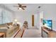 Cozy living room with comfy sofa, ceiling fan and a flat-screen TV at 430 Botticelli Dr # 430, Nokomis, FL 34275