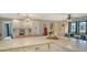 Large kitchen island with white cabinets and quartz countertops at 4842 Greywood Ln, Sarasota, FL 34235