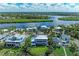 Wide shot of waterfront home and canal at 506 S Casey Key Rd, Nokomis, FL 34275