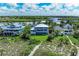 Waterfront property with backyard and neighboring homes at 506 S Casey Key Rd, Nokomis, FL 34275