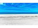 White sandy beach with blue ocean under a bright sky at 506 S Casey Key Rd, Nokomis, FL 34275