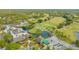 Aerial view of golf course, clubhouse, and community at 5218 Wedgewood Ln # 72, Sarasota, FL 34235