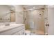 Clean bathroom featuring a walk-in shower and white vanity at 5218 Wedgewood Ln # 72, Sarasota, FL 34235