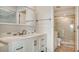 Bright bathroom with white vanity, shower, and tile flooring at 5218 Wedgewood Ln # 72, Sarasota, FL 34235