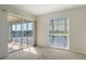 Bedroom with water views, sliding door to balcony, and neutral decor at 5218 Wedgewood Ln # 72, Sarasota, FL 34235