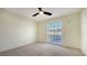 Charming bedroom with carpeted floors and a window with blinds at 5218 Wedgewood Ln # 72, Sarasota, FL 34235