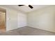 Simple bedroom with ceiling fan, carpeting, and double-door closet at 5218 Wedgewood Ln # 72, Sarasota, FL 34235