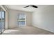 Bright bedroom with neutral walls, carpet, and water views at 5218 Wedgewood Ln # 72, Sarasota, FL 34235