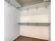 Spacious closet with double hanging rods and shelving at 5218 Wedgewood Ln # 72, Sarasota, FL 34235