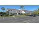 Exterior view of the building with parking and landscaping at 5218 Wedgewood Ln # 72, Sarasota, FL 34235