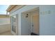 Well-maintained condo building entrance with a tan door at 5218 Wedgewood Ln # 72, Sarasota, FL 34235