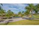 Scenic view of the golf course with palm trees at 5218 Wedgewood Ln # 72, Sarasota, FL 34235