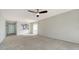 Bright living room features neutral walls, carpet, and access to kitchen at 5218 Wedgewood Ln # 72, Sarasota, FL 34235