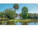Serene pond with fountain and lush greenery at 5218 Wedgewood Ln # 72, Sarasota, FL 34235