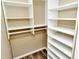 Well-organized walk-in closet with built-in shelves at 5330 Hyland Hills Ave # 2311, Sarasota, FL 34241