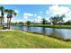 Scenic waterfront property with lush landscaping and golf course views at 5330 Hyland Hills Ave # 2311, Sarasota, FL 34241