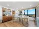 Coastal-inspired dining area with round table, four chairs, and ocean views at 5780 Midnight Pass Rd # 605, Sarasota, FL 34242