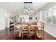 Bright dining area with a large table and hardwood floors at 5790 Spider Lily Cir, Sarasota, FL 34238