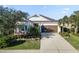 Charming single-story home with landscaped yard and driveway at 5790 Spider Lily Cir, Sarasota, FL 34238