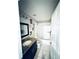 Clean bathroom, granite vanity, and bathtub shower combo at 5809 Leopardstown Dr, Tampa, FL 33610
