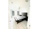 Bedroom with a large bed, nightstands and window coverings at 5809 Leopardstown Dr, Tampa, FL 33610