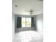 Bedroom with water view, tile floors, and ceiling fan at 5809 Leopardstown Dr, Tampa, FL 33610