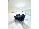 Dining room with a dark wood table and six black chairs at 5809 Leopardstown Dr, Tampa, FL 33610