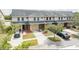 Townhouse community with a pond view and parking at 5809 Leopardstown Dr, Tampa, FL 33610