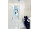 Bright hallway with tile floors and shoe storage at 5809 Leopardstown Dr, Tampa, FL 33610