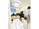 Kitchen with wood cabinets, stainless steel appliances and tile floor at 5809 Leopardstown Dr, Tampa, FL 33610