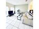 Spacious living room with tile floors and comfy seating at 5809 Leopardstown Dr, Tampa, FL 33610