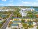 Aerial view of the property, highlighting its location near a road and other structures at 5955 Midnight Pass Rd # 4E, Sarasota, FL 34242