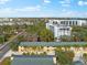 Wide aerial view of the property, showing its location and surrounding buildings at 5955 Midnight Pass Rd # 4E, Sarasota, FL 34242