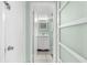 Clean bathroom with white vanity and frosted glass door at 5955 Midnight Pass Rd # 4E, Sarasota, FL 34242