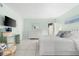 Bedroom with a queen bed, white dresser, and sliding door access at 5955 Midnight Pass Rd # 4E, Sarasota, FL 34242