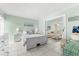 Bedroom with queen bed and view into living room at 5955 Midnight Pass Rd # 4E, Sarasota, FL 34242