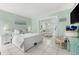 Spacious bedroom with king bed, coastal decor, and view of living area at 5955 Midnight Pass Rd # 4E, Sarasota, FL 34242