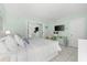 Bright bedroom with a king-size bed and beachy decor at 5955 Midnight Pass Rd # 4E, Sarasota, FL 34242
