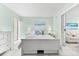 Bedroom with a queen bed, white dresser, and sliding door access at 5955 Midnight Pass Rd # 4E, Sarasota, FL 34242