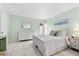 Bedroom with white dresser and a queen-size bed, beach decor at 5955 Midnight Pass Rd # 4E, Sarasota, FL 34242