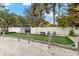 Community bocce ball court with green turf and wooden border at 5955 Midnight Pass Rd # 4E, Sarasota, FL 34242