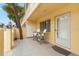 Condo building exterior with a private patio and seating area at 5955 Midnight Pass Rd # 4E, Sarasota, FL 34242