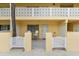 Condo building exterior showcasing a private entrance and patio at 5955 Midnight Pass Rd # 4E, Sarasota, FL 34242