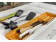 Well-organized kitchen drawer with various cooking utensils and knives at 5955 Midnight Pass Rd # 4E, Sarasota, FL 34242