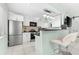 Modern kitchen with stainless steel appliances and white cabinets at 5955 Midnight Pass Rd # 4E, Sarasota, FL 34242